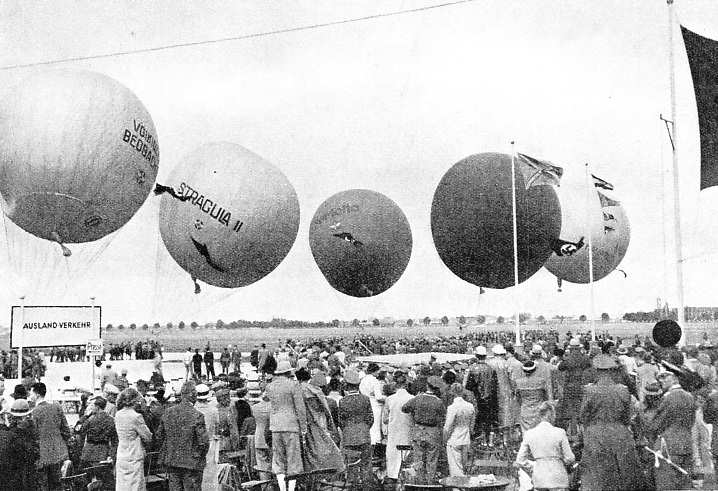 PREPARING BALLOONS FOR FLIGHT IN A HIGH WIND at an air sports meeting at Munich