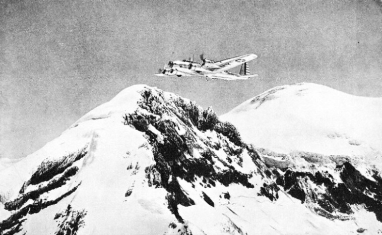 A UNITED STATES ARMY AIR CORPS MACHINE in flight above Mount Rainier