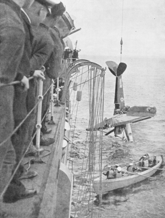 HOISTING A DAMAGED QUEEN BEE ON BOARD A WARSHIP