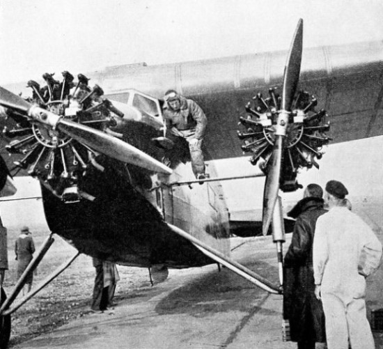 CLIMBING ON BOARD the Southern Cross before his flight across America in 1930