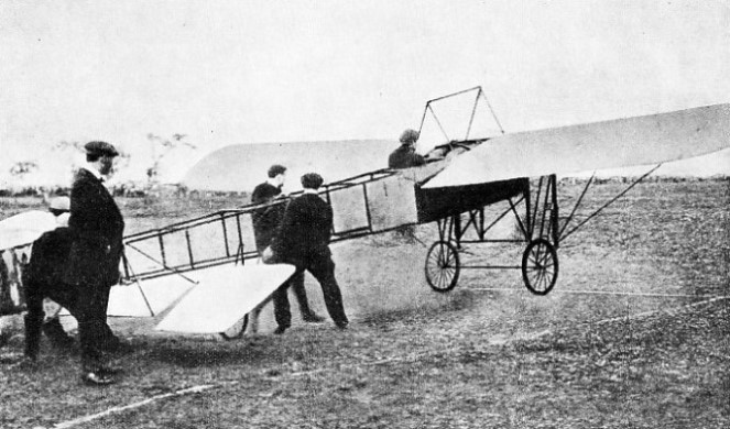 MECHANICS HOLD THE TAIL of one of Grahame-White’s Bleriot monoplanes